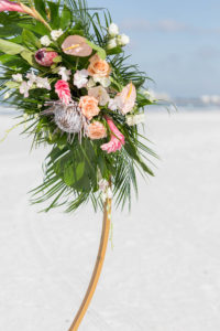 Beach Wedding Round Arch Floral Arrangement Spray | Tropical Wedding Flowers with Monstera Leaf Greenery, Peach Roses, White Anthurium, and Pink Protea