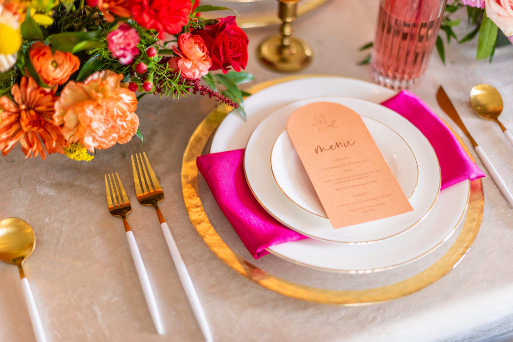 Tampa Wedding Styled Shoot 70's Retro Vintage | Colorful Vibrant Rainbow Wedding | Gold Rim Charger and China with Dipped Gold Flatware and Colorful Napkin by Kate Ryan Event Rentals