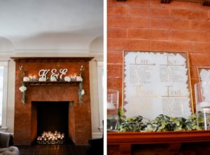 Classic Wedding Decor, Red Brick Fireplace Mantle with Large Wooden Laser Cut Bride and Groom Initials, White Floral Arrangements, Greenery Garland, Floating Candles, Gold Fram Acrylic Seating Chart | Tampa Bay Wedding Photographer Lifelong Photography Studio | Wedding Planner Core Concepts