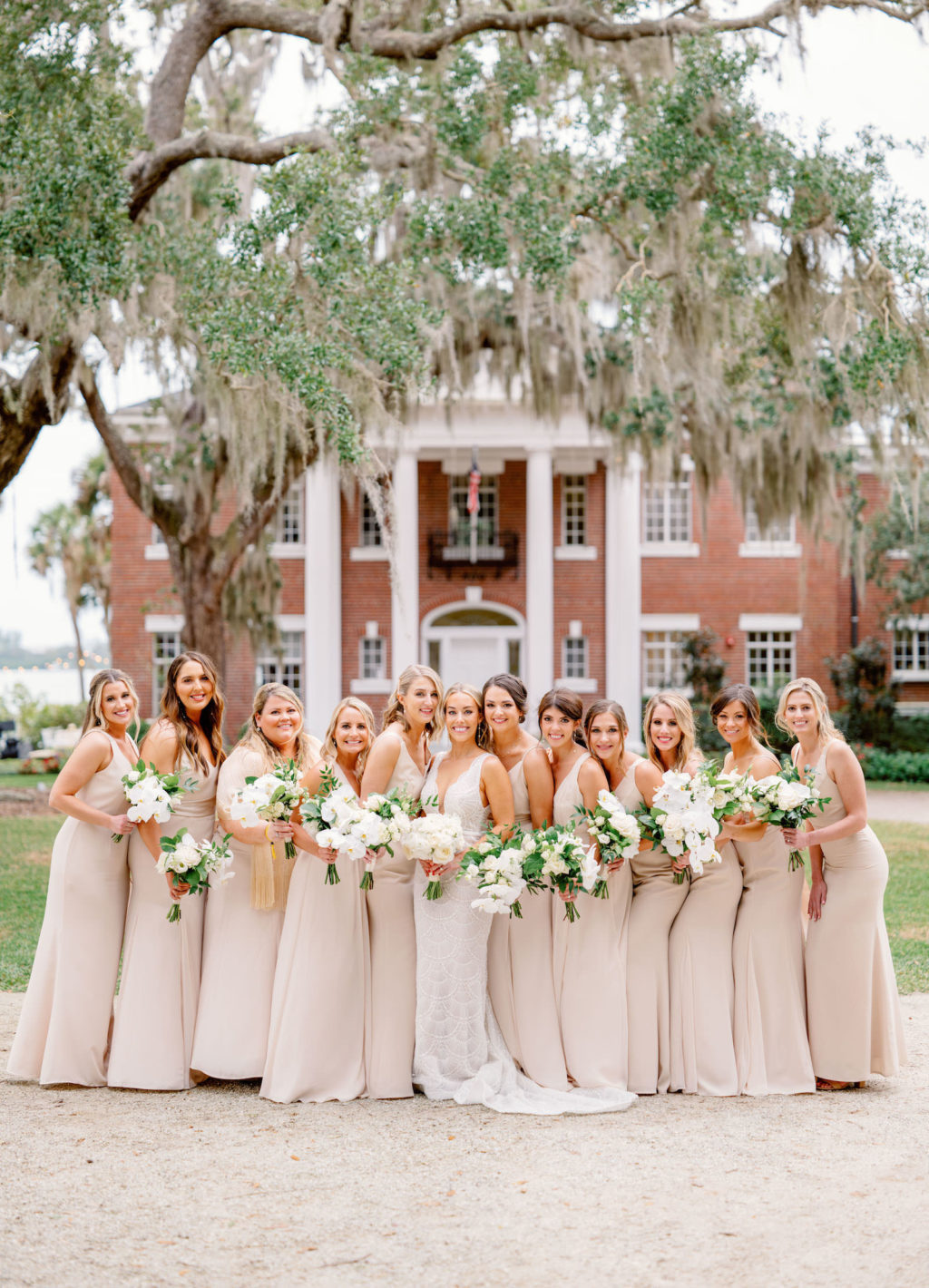 Elegant Bride in Jane Hil Beaded Luella Wedding Dress and Bridesmaids in Champagne Dresses Bridal Part Photo | Waterfront Wedding Venue Bay Preserve at Osprey