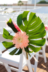 Tropical Wedding Ceremony Decor, Monstera Palm Leaf with Pink Flower Arrangement on Chair | Tampa Bay Wedding Photographer Limelight Photography | Waterfront Wedding Venue Yacht StarShip