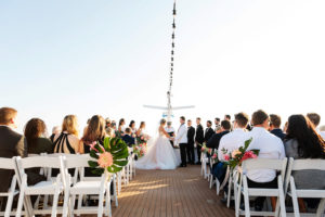 Tropical Bride and Groom Exchanging Wedding Vows on Waterfront Wedding Venue Yacht StarShip | Tampa Bay Wedding Photographer Limelight Photography