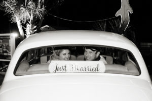 Florida Bride and Groom in Wedding Reception Getaway Car and Just Married Sign | Tampa Bay Wedding Photographer Limelight Photography