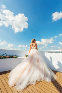Florida Bride Wearing Princess Ballgown Strapless Tulle Skirt with Blush Pink Lining and Floral Belt Wedding Dress on Deck of Waterfront Wedding Venue Yacht StarShip | Tampa Bay Wedding Photographer Limelight Photography