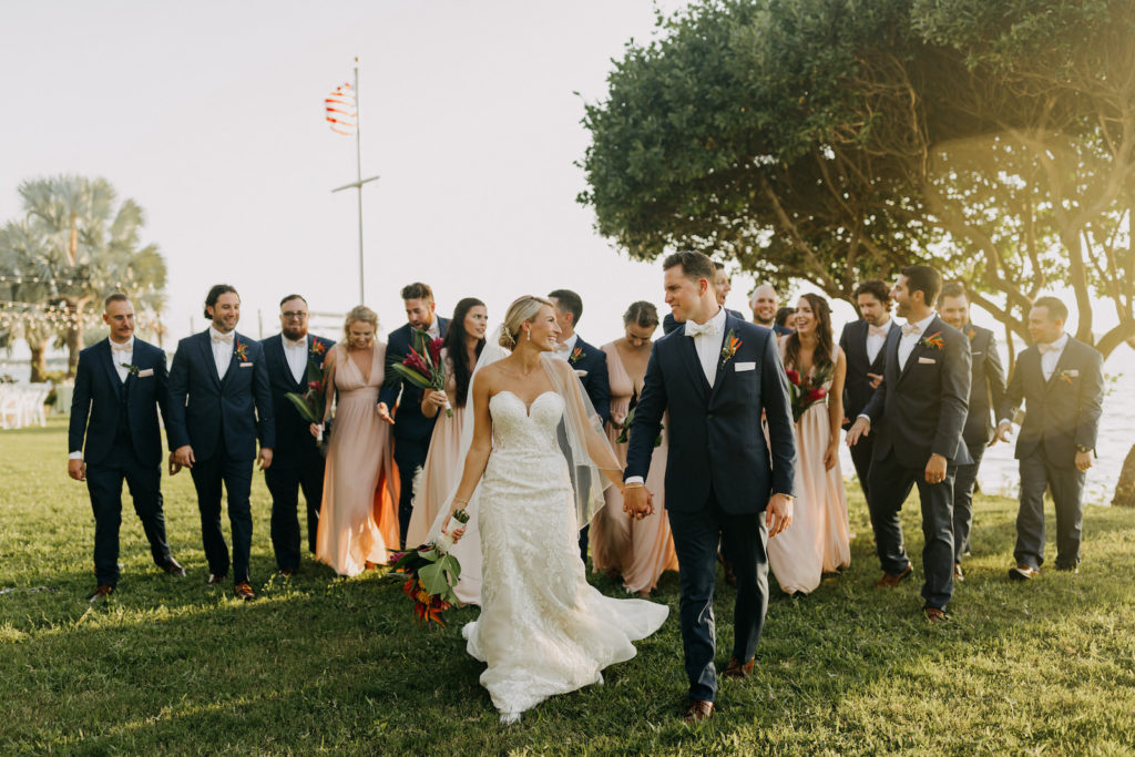Florida Tropical Elegant Bride in Stella York Lace and Illusion Strapless Wedding Dress, Groom, Bridesmaids in Blush Pink Dresses, Groomsmen in Blue Suits and White Bowties Wedding Party Photo | Tampa Bay Wedding Photographer Amber McWhorter Photography