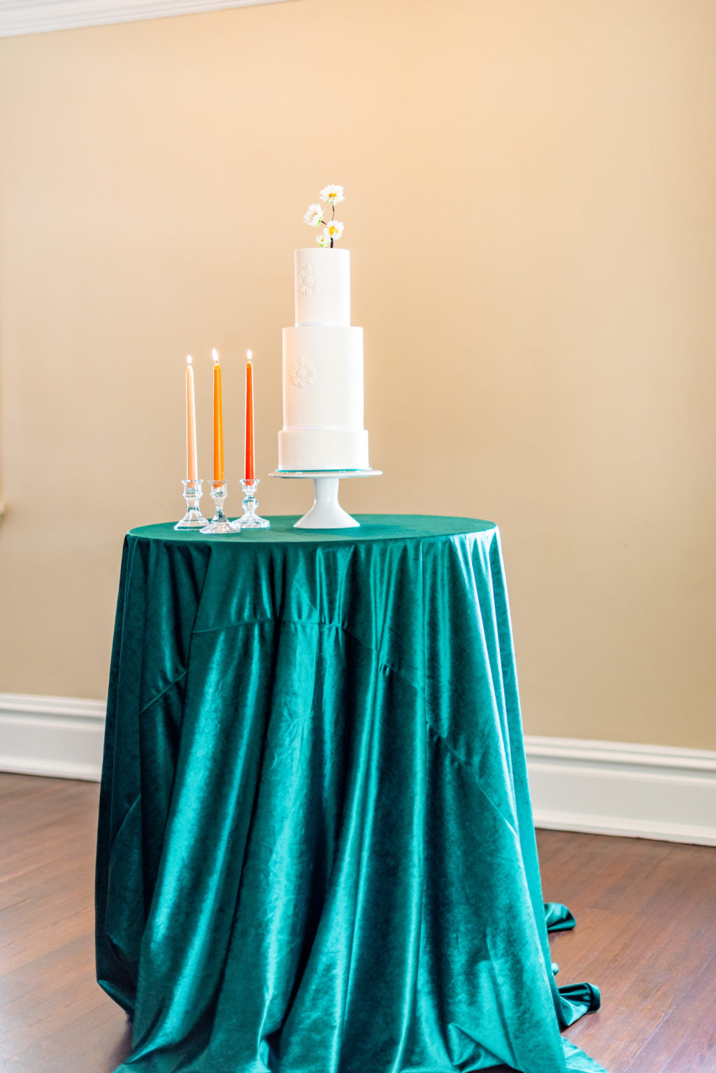 Tampa Wedding Styled Shoot 70's Retro Vintage | White Pattern Embossed Mosaic Fondant Wedding Cake with Sugar Flowers | Emerald Green Velvet Cake Table Linen with Colorful Taper Candles