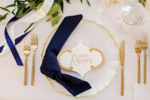 Classic Wedding Reception Decor, Gold Flatware, Gold Rimmed and Milky White Scalloped Charger, Navy Blue Linen Napkin, Geometric White and Gold Personalized Cookie Wedding Favor | Tampa Bay Wedding Photographer Lifelong Photography Studio | Wedding Planner Core Concepts | Wedding Rentals A Chair Affair | Kate Ryan Event Rentals