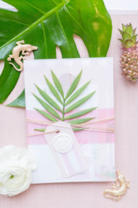 Florida Beach Wedding Invitation Suite Stationery Set Flat Lay with Tropical Greenery and Light Soft Blush Pink Wax Seal