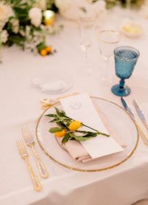 Elegant Luxurious Wedding Reception Decor, Gold Rimmed and Clear Glass Charger, Gold Flatware, Blue Water Goblet, Lemon Sprig on Menu | Tampa Bay NK Productions Wedding Planning