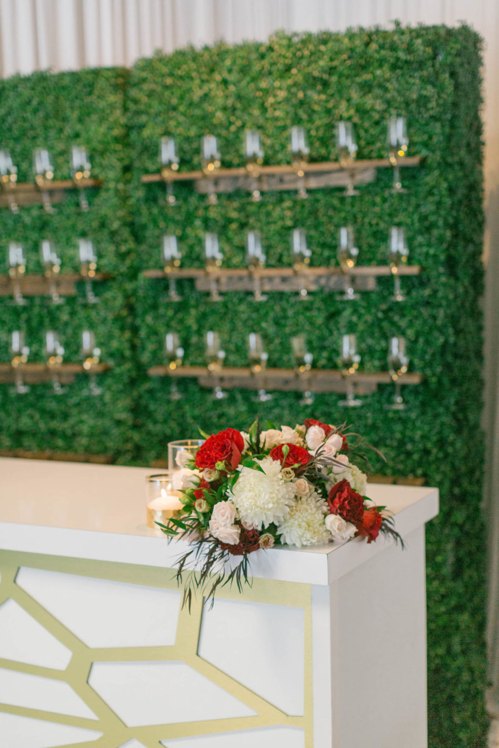 Champagne Glass Hedge Grass Wall with Gold Bar | Styled with Love Influencer Wedding | St. Pete Beach Wedding Venue Bellwether Beach Resort