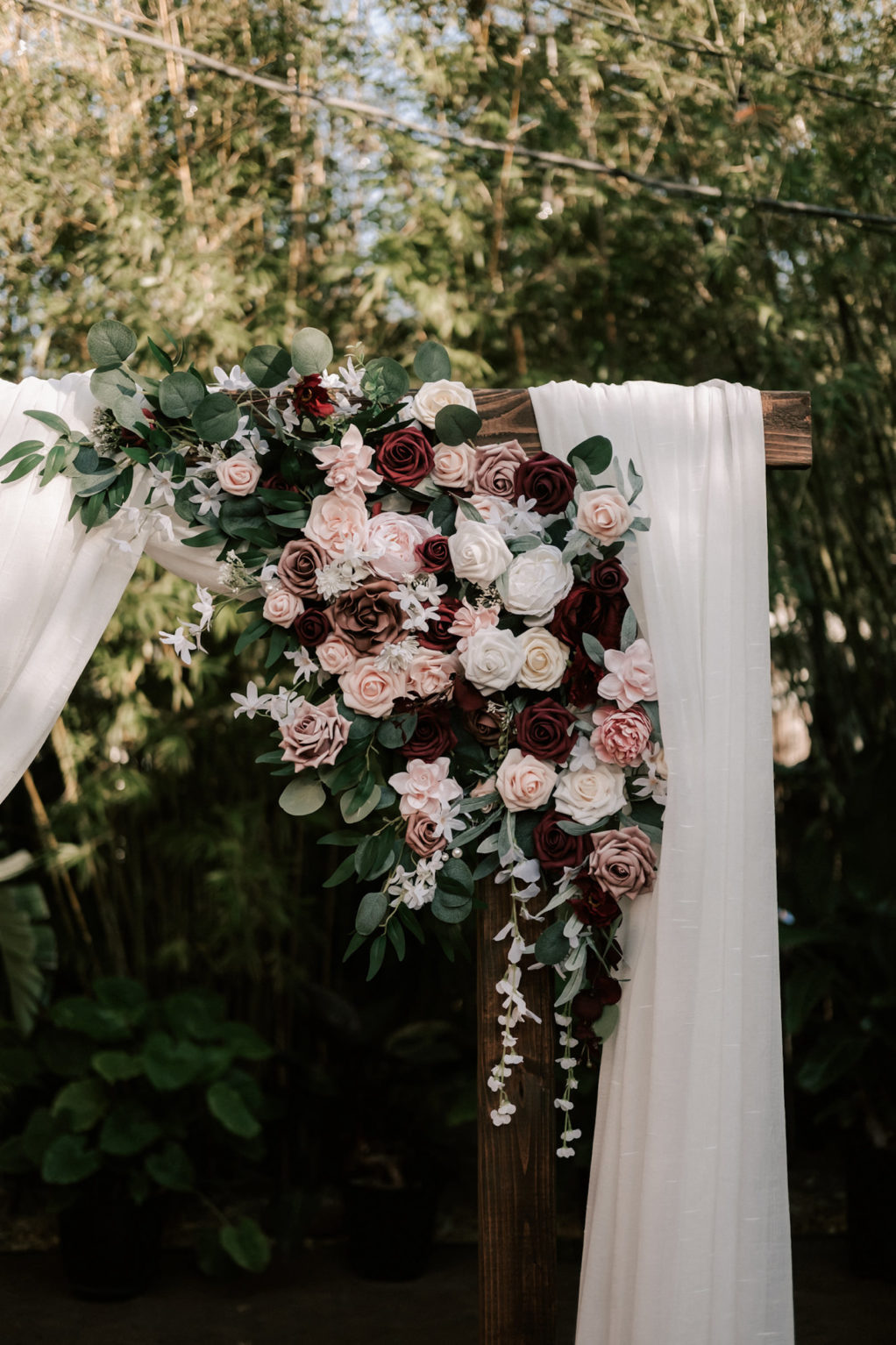 Industrial Inspired Wedding with Romantic Moody Florals, Ceremony Arch with Soft White Draping, Pink, Red, White and Burgundy Roses with Eucalyptus Greenery | Tampa Bay's Best Wedding Venue NOVA 535 in Downtown St. Pete Florida