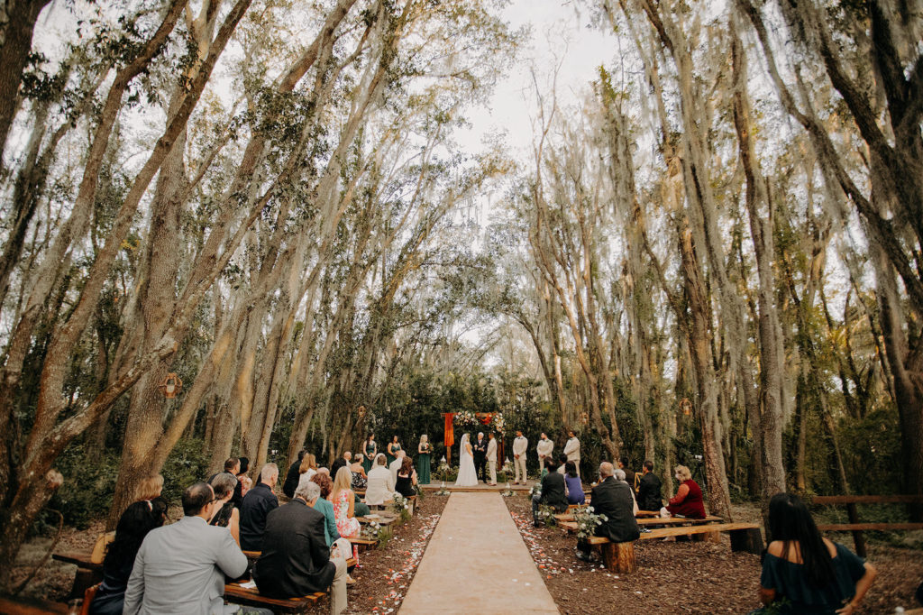 Rustic Tampa Wedding Ceremony Decor Outside Under Trees in Plant City Wedding Venue Florida Rustic Barn Wedding Venue