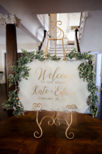 Classic Modern Acrylic and Gold Wedding Welcome Sign with Greenery Garland | Tampa Bay Wedding Photographer Lifelong Photography Studio | Wedding Planner Core Concepts | Wedding Rentals Kate Ryan Event Rentals | A Chair Affair