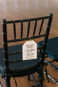 Black Chiavari Wedding Ceremony Chairs with Mother of the Bride Reserved Sign