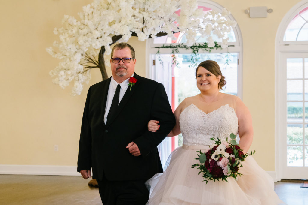 Bride and Father Walking Down the Wedding Ceremony Aisle
