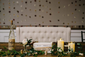 Vintage Book Wedding Centerpiece with Wine Bottle and Candle and Greenery | Reception Decor Inspiration