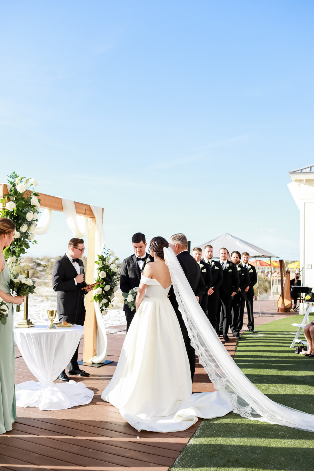 Florida Timeless Bride and Groom Exchanging Wedding Vows on Waterfront Lawn Ceremony at Clearwater Beach Wedding Venue Sandpearl Resort | Tampa Bay Wedding Photographer Lifelong Photography Studio | Wedding Planner Blue Skies Weddings and Events | Wedding Florist Iza's Flowers