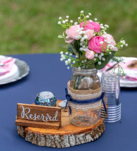 DIY Intimate Backyard Wedding Reception Decor, Round Tables with Navy Blue Table Linens, Blush Pink Napkins, Wooden Tray Centerpiece with Mason Jar, Pink Roses and White Baby's Breathe, Silver Chargers