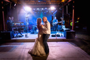 Intimate DIY Backyard Tampa Bride and Groom Dancing at Wedding Reception to Live Band