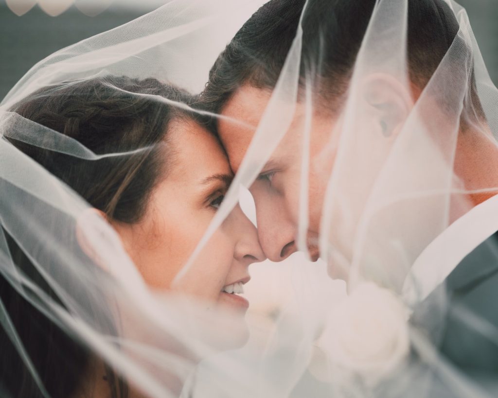 Florida Minimalistic Bride and Groom Under Wedding Veil | Tampa Bay Wedding Photographer and Videographer Bonnie Newman Creative
