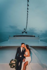 Romantic Minimalistic Bride with Full Length Veil, Groom in Navy Blue Suit and Pink Tie Holding Bride's Greenery and White Floral Bouquet | Tampa Bay Waterfront Wedding Venue Yacht StarShip | Wedding Photographer and Videographer Bonnie Newman Creative