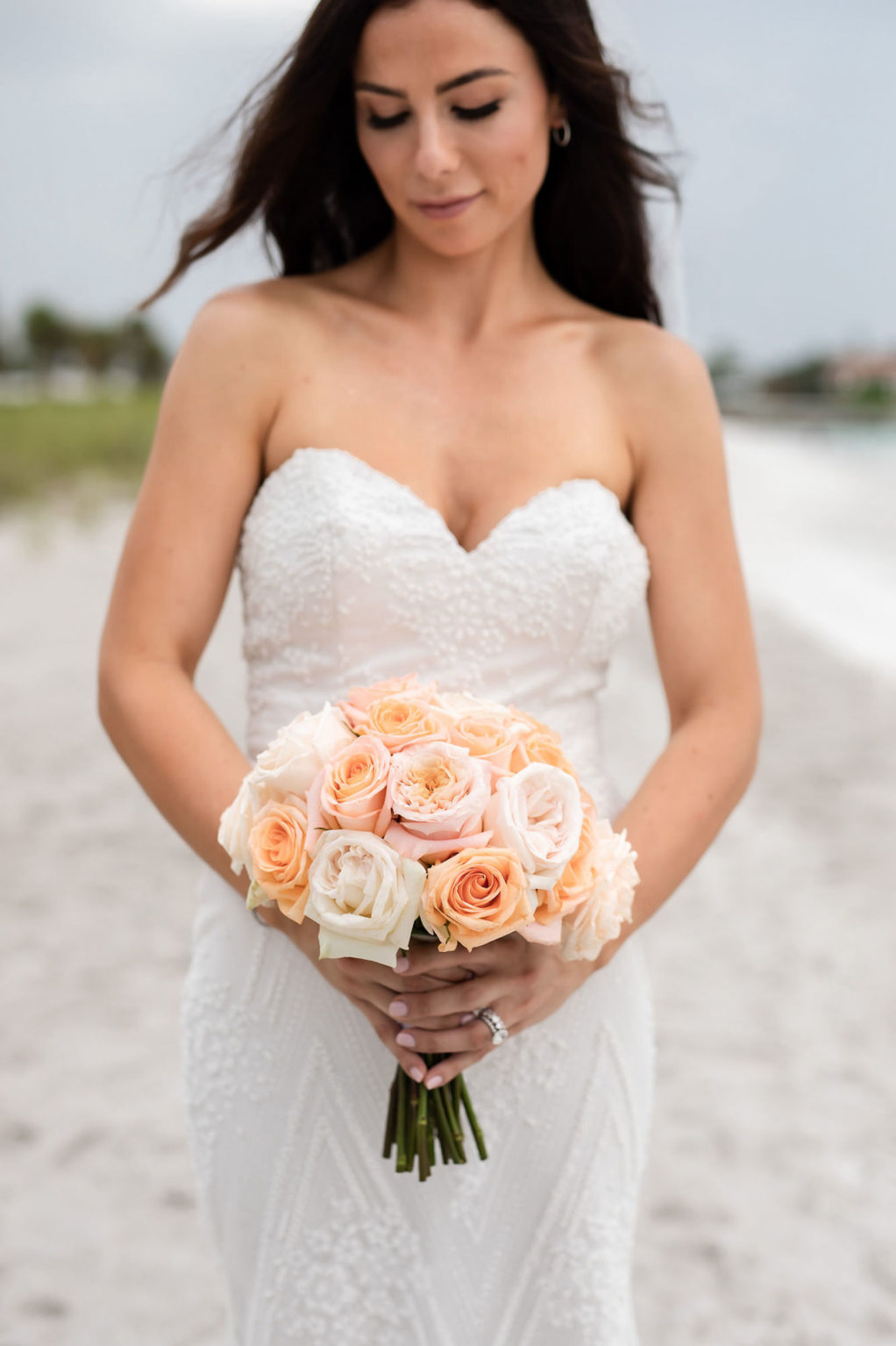 Outdoor Bridal Portrait | Strapless Sheath Embroidered Wedding Dress Bridal Gown by Designer Tara Keilly | Simple Round Bridal Wedding Bouquet with Peach Pink and Coral Roses