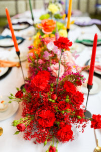 Colorful Rainbow Gay LGBTQ+ Pride Wedding Reception Decor, Red, Pink, Yellow Flower Long Centerpiece and Candlesticks | Tampa Bay Wedding Planner Stephany Perry Events