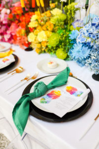 Modern Gay LGBTQ+ Pride Colorful Modern Rainbow Wedding Reception Decor, Green Napkin Linen, Rainbow Watercolor Menu Stationery, Black Charger, Blue, Green, Yellow, Orange and Red Flower Long Centerpiece and Candlesticks | Tampa Bay Wedding Planner Stephany Perry Events