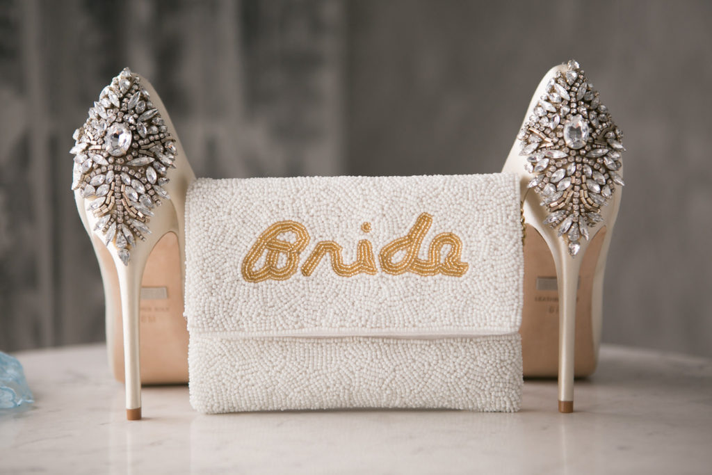 Elegant Bride Wedding Accessories, White Beaded Clutch with Gold Word Bride Beaded, Ivory Badgley Mischka Wedding Shoes with Rhinestone Brooch | Tampa Bay Wedding Photographer Carrie Wildes Photogrpahy