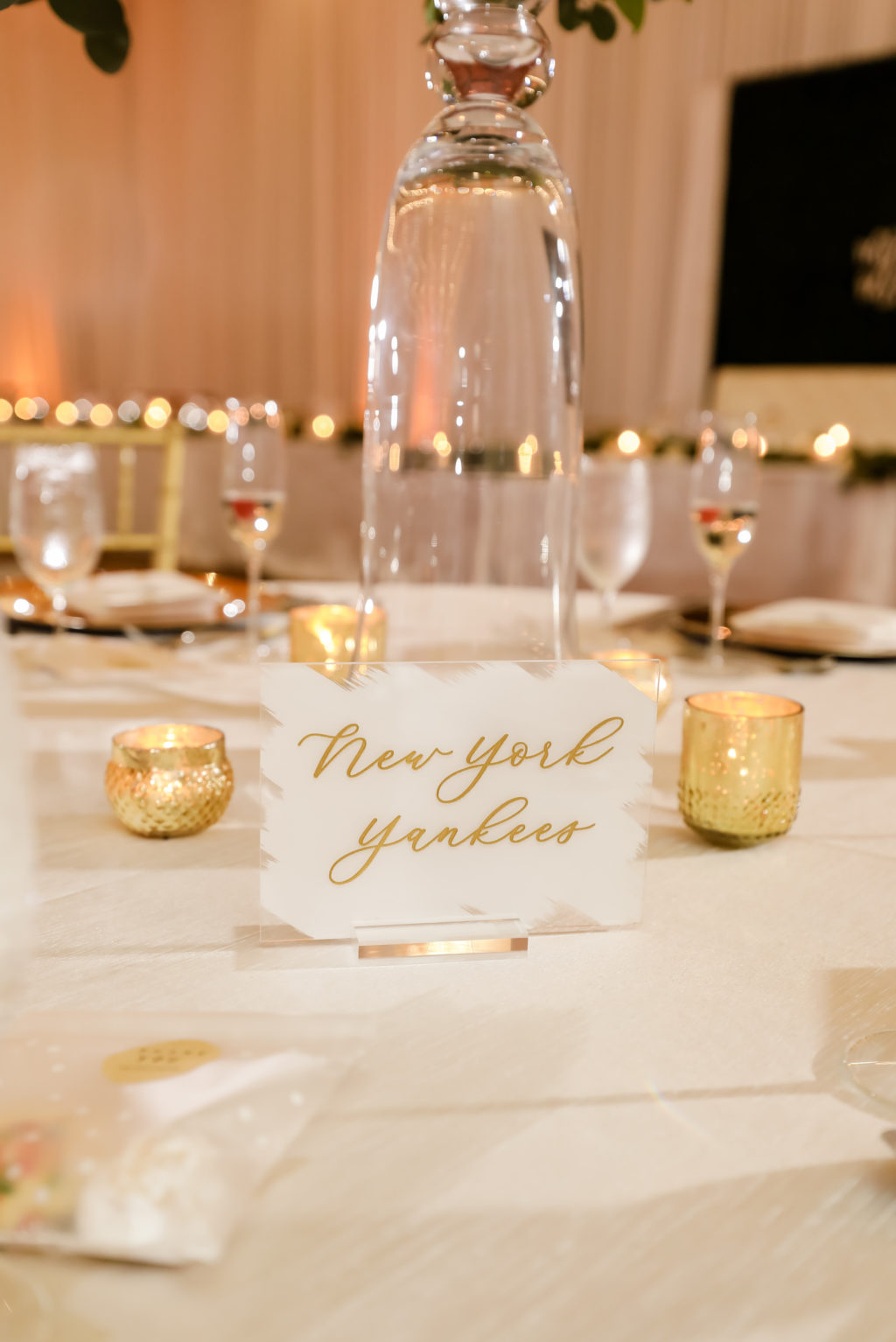 Elegant Wedding Reception Decor, Unique Acrylic White and Gold Table Place Card "New York Yankees" | Tampa Bay Wedding Photographer Lifelong Photography Studio | Clearwater Beach Wedding Planner Blue Skies Weddings and Events