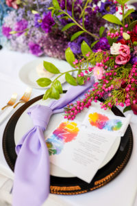 Modern Colorful Rainbow Gay LGBTQ+ Pride Wedding Reception Decor, Purple Linen Napkin, Black and Gold Charger, Watercolor Rainbow Stationery Menu, Pink and Purple Flower Centerpiece | Tampa Bay Wedding Planner Stephany Perry Events