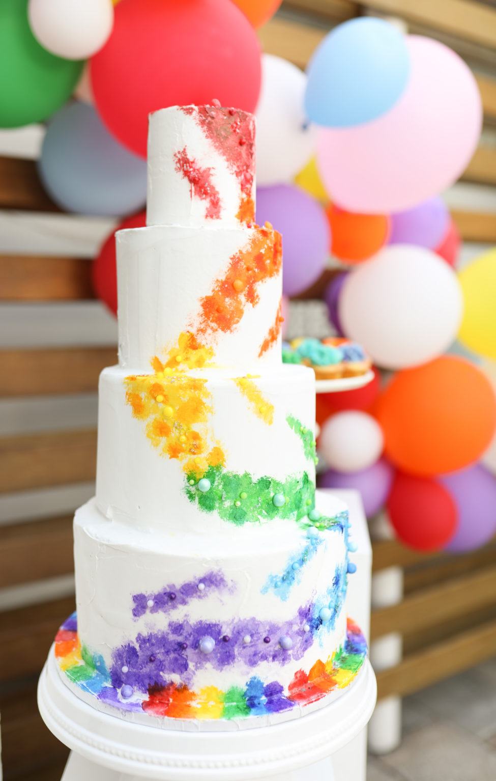 Unique Modern Gay LGBTQ+ Pride Wedding, Four Tier White with Rainbow, Purple, Blue, Green, Yellow, Orange and Red Painted Colors, Colorful Balloon Arch | Tampa Bay Wedding Planner Stephany Perry Events