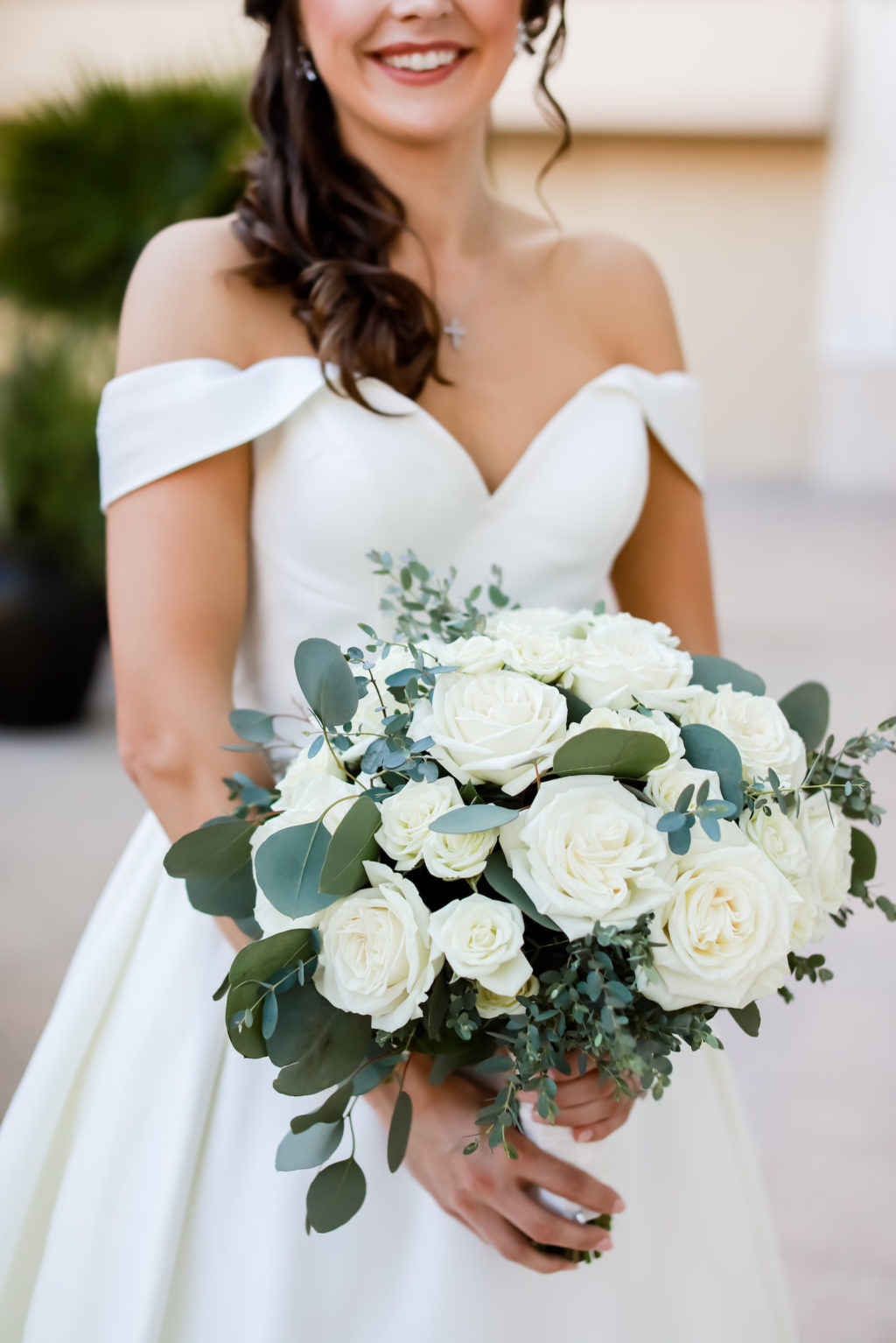 Classic Bride Wearing Off the Shoulder Sweetheart V Neckline Wedding Dress Holding White Roses and Eucalyptus Greenery Floral Bouquet | Tampa Bay Wedding Photographer Lifelong Photography Studio | Clearwater Beach Florist Iza's Flowers