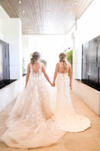 Gay LGBTQ+ Pride Wedding, Lesbian Brides in Romantic Wedding Dresses, Lace and Illusion Open V Back A-Line Wedding Dress, Fitted Open Back Spaghetti Strap Wedding Dress with Bow | Tampa Bay Wedding Venue Hotel Alba