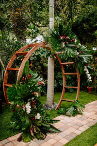 Outdoor Florida Wedding, Backyard Ceremony with Jungle Inspired Decor with Bamboo Circle Arch, Bright Greenery with pops of Pink Florals and White Orchids | St. Petersburg Wedding Planner Parties A'La Carte