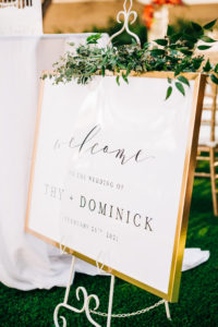 Elegant Garden Wedding Ceremony Decor, White Welcome Sign in Gold Frame with Greenery Garland | Tampa Bay Wedding Florist Monarch Events and Design