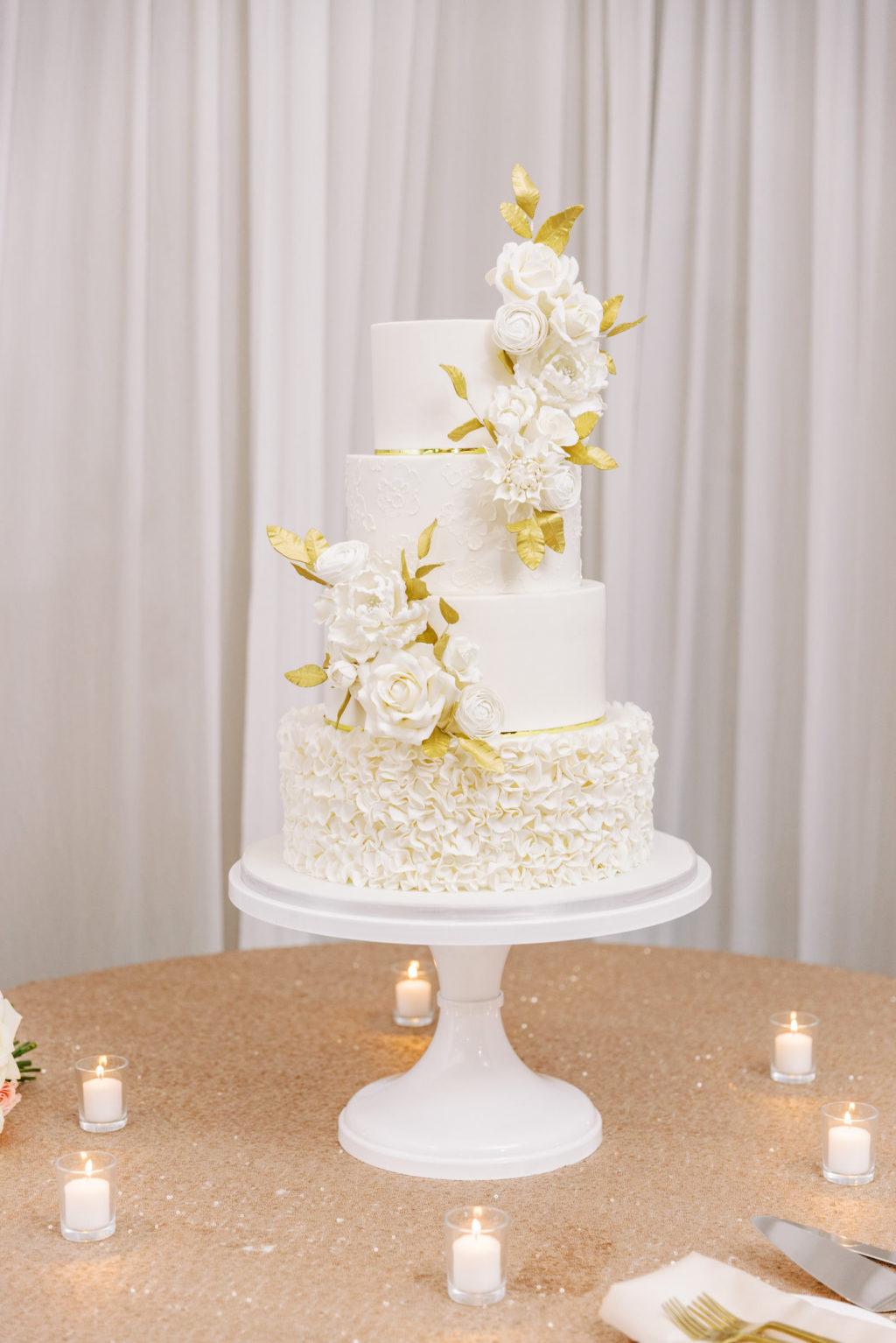 Modern Elegant White Four Tier Wedding Cake with Sugar Roses and Gold Foil Leafs, Gold Sequin Table Linens | Florida Wedding Planner Parties A'La Carte | Tampa Bay Rental Company Over The Top Linen Rentals