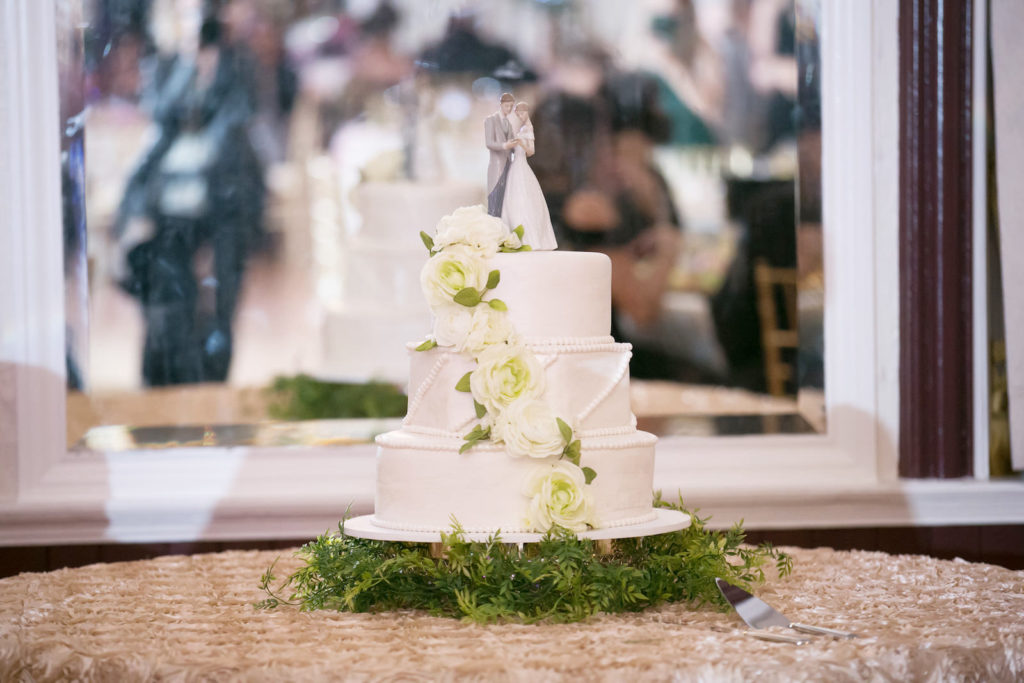 Three Tier White Wedding Cake | Simplistic and Floral Detail with Bride and Groom Cake Topper