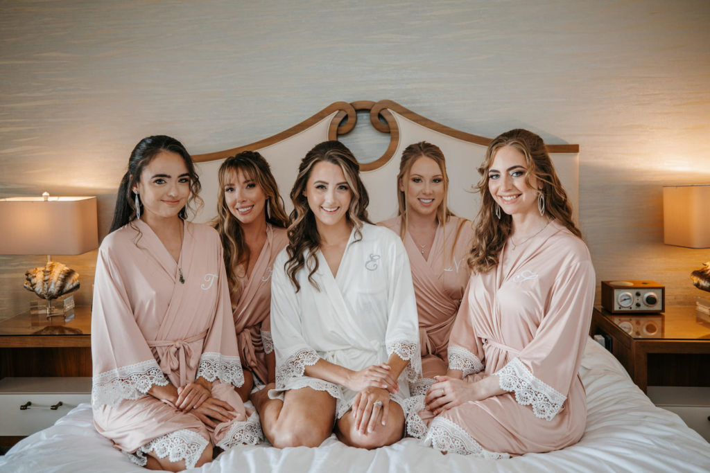 Tampa Bride with Bridesmaids in Blush Pink Monogram Embroidered Robes Getting Wedding Ready
