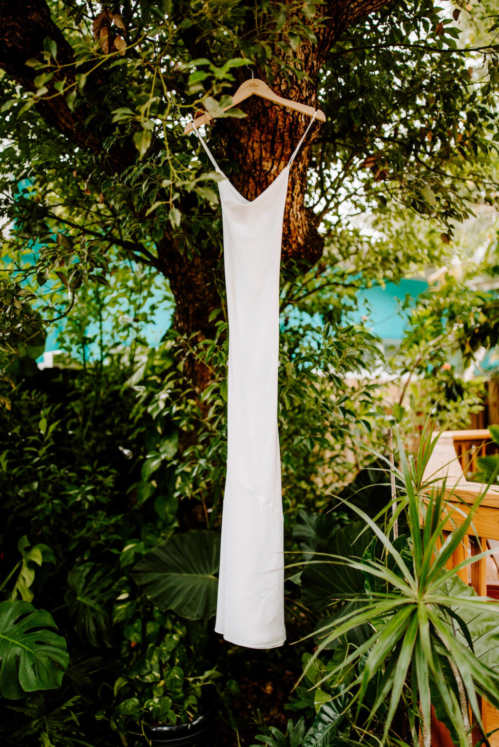 Tampa Bay Bridal Details, Florida Backyard with Show Me Your Mumu White Wedding Dress Hanging in Jungle