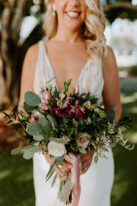 Tampa Bride Holding Wild Greenery Eucalyptus with Purple Flowers Wedding Bouquet