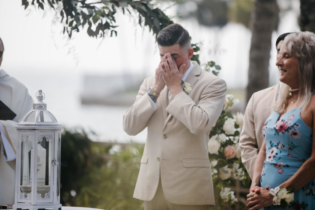 Emotional Groom Wearing Tan Suit During Wedding Ceremony
