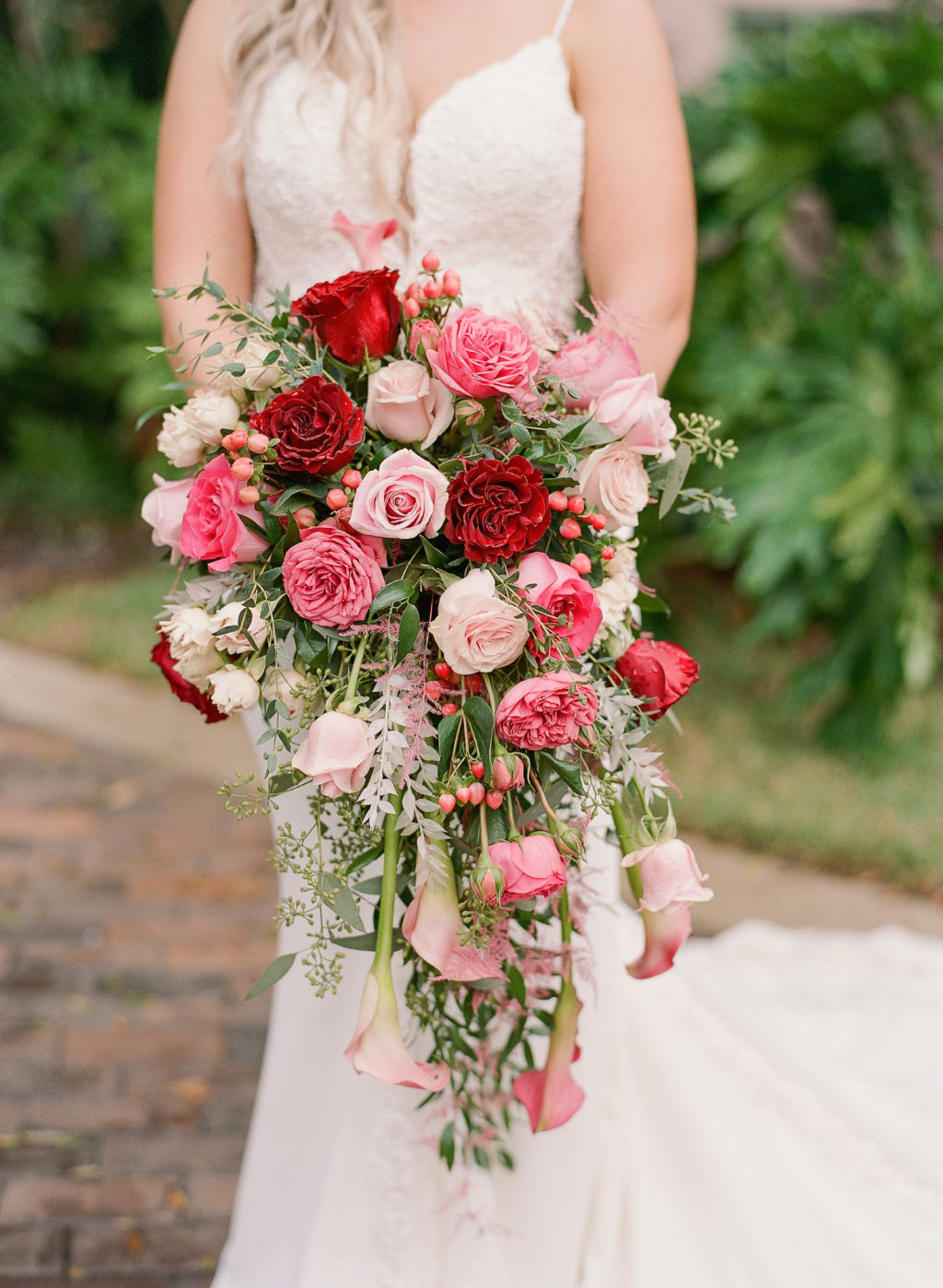 Tampa Bride Holding Pink and Red Roses Lush Floral Bouquet with Greenery