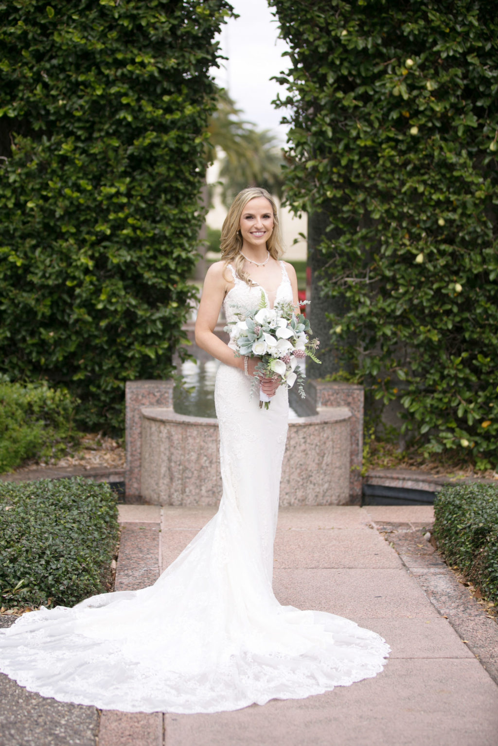 Beautiful Blushing Bride in Sweetheart Neckline and Long Train | Tampa Bay Wedding Photographer Carrie Wildes Photography
