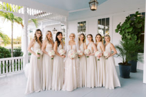 Classic Florida Bride and Bridesmaids at Belleview Inn, Wearing Long Matching Champagne Jenny Yoo Bridesmaid Dresses, Bride wearing Romantic A Line Adam Zohar Wedding Dress, Holding Elegant Floral Bouquet with Ivory, Pink and White Flowers | Couture Central Florida Wedding Boutique Isabel O'Neil Bridal Collection | South Tampa Bella Bridesmaids | Clearwater Luxury Floral Designer Bruce Wayne Florals | Tampa Bay Wedding Planner Parties A'La Carte