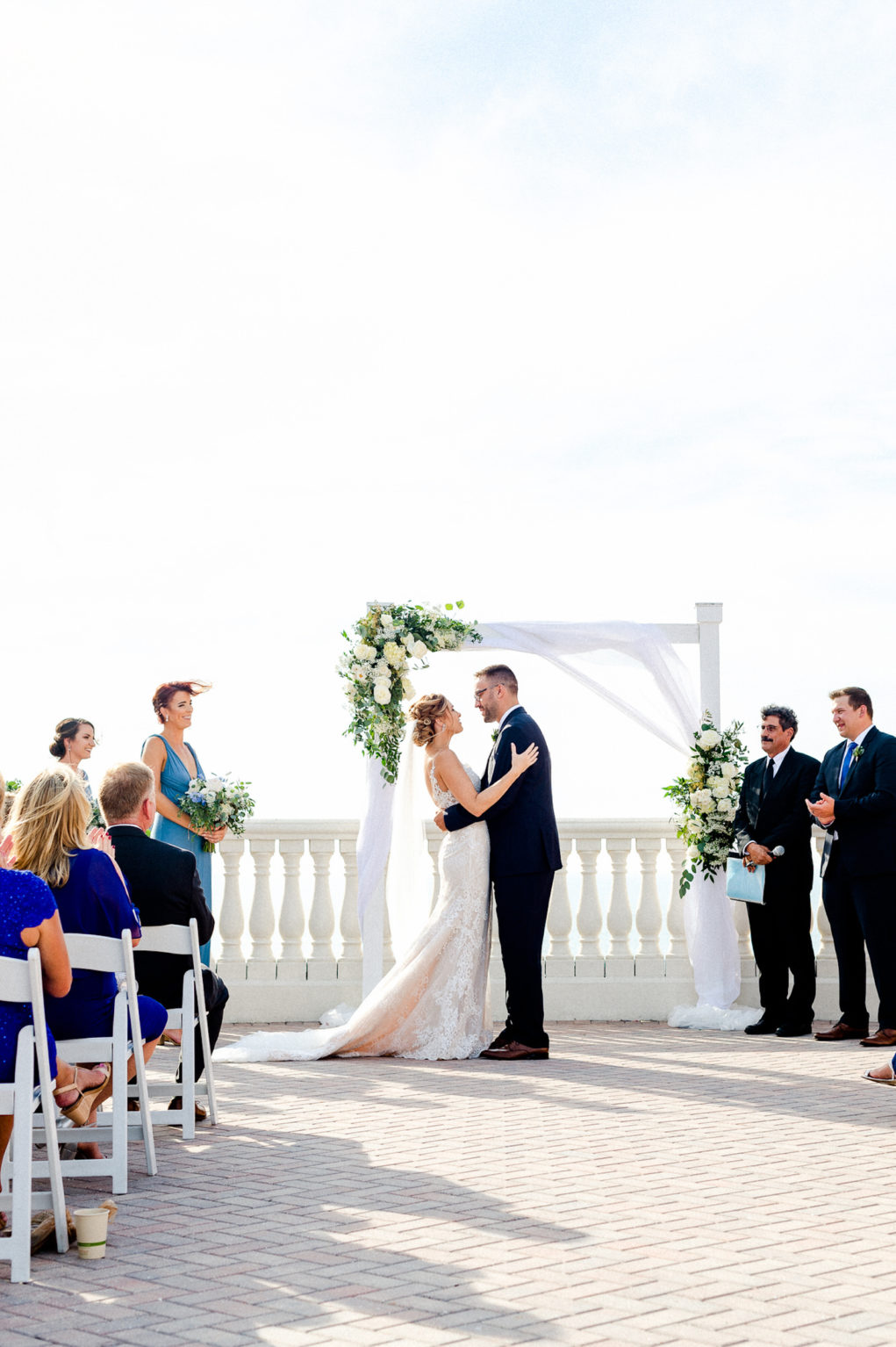 Bride and Groom at Waterfront Wedding Ceremony | Dewitt for Love Photography