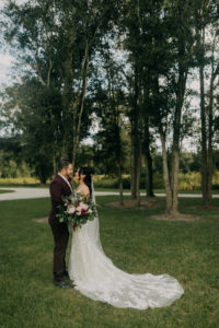 Romantic Dark and Moody Bride and Groom Romantic Outdoor Wedding Portrait | Tampa Bay Wedding Photographer Amber McWhorter Photography | Wedding Florist Brides & Blooms | Wedding Venue Paradise Spring