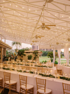 Romantic Elegant Outdoor Courtyard Golf Course Wedding Reception Decor, String Lights, Long Tables with White Linens, Greenery Garland Table Runner, Gold Chiavari Chairs, Candlesticks | Sarasota Waterfront Wedding Venue The Resort at Longboat Key Club