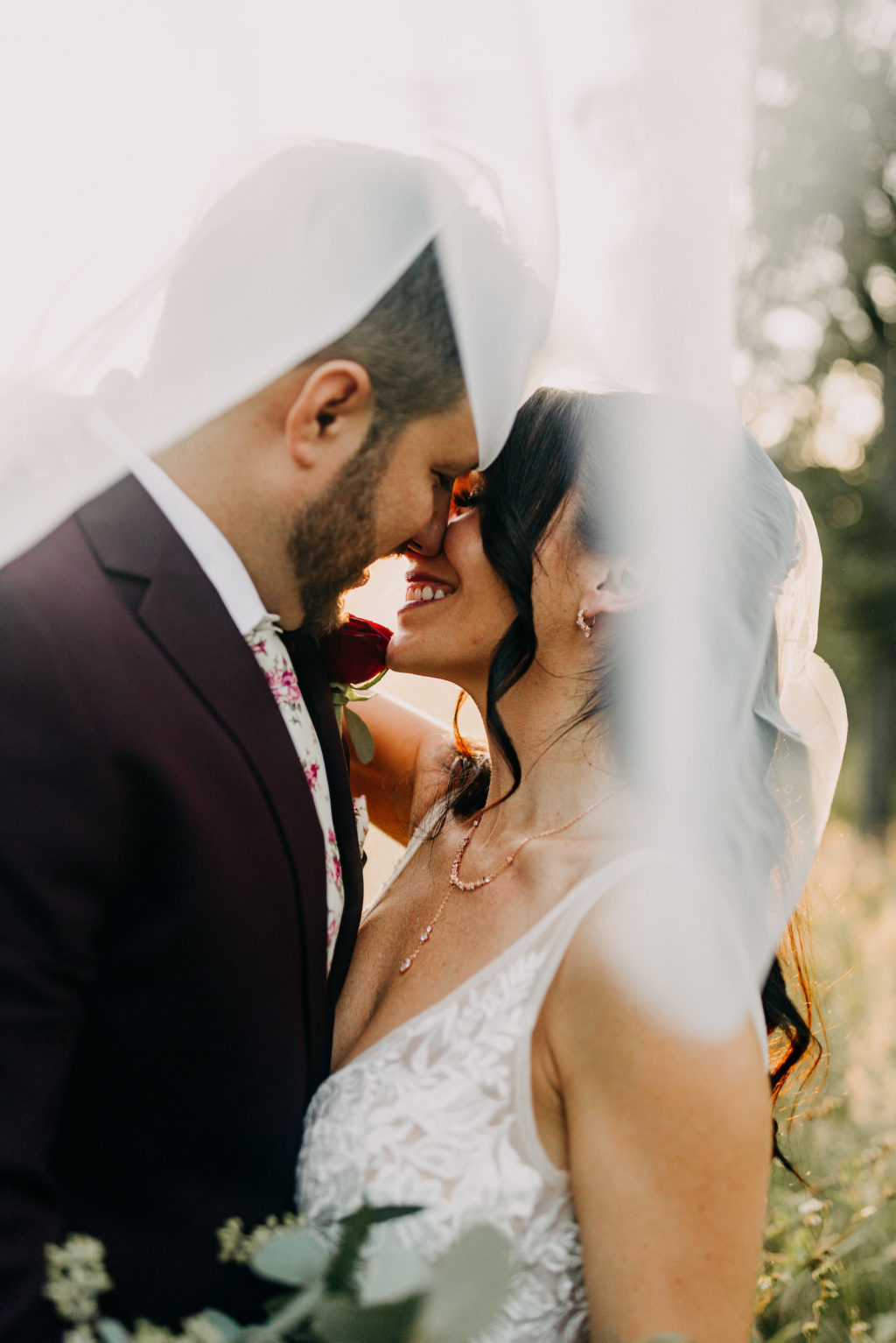 Romantic Unique Creative Bride and Groom Sunset Under Veil Kissing Portrait | Tampa Bay Wedding Photographer Amber McWhorter Photography