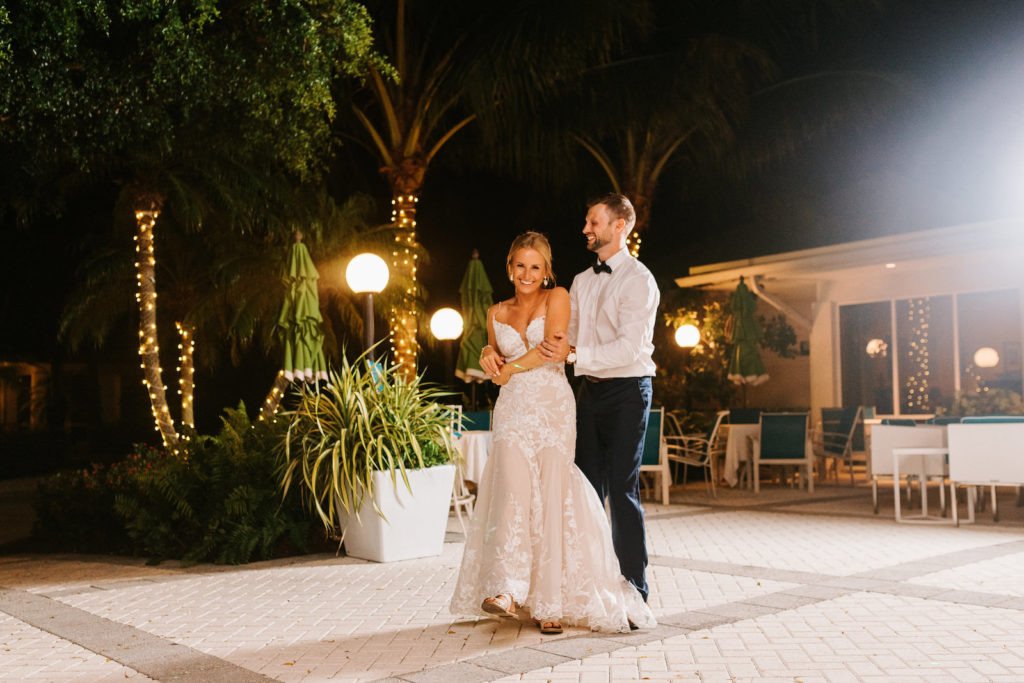 Romantic Florida Bride in Lace Spaghetti Strap and Nude Lining Wedding Dress and Sandals with Groom First Dance Wedding Reception Photo | Sarasota Wedding Venue The Resort at Longboat Key Club